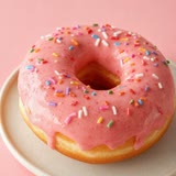 A pink glazed doughnut